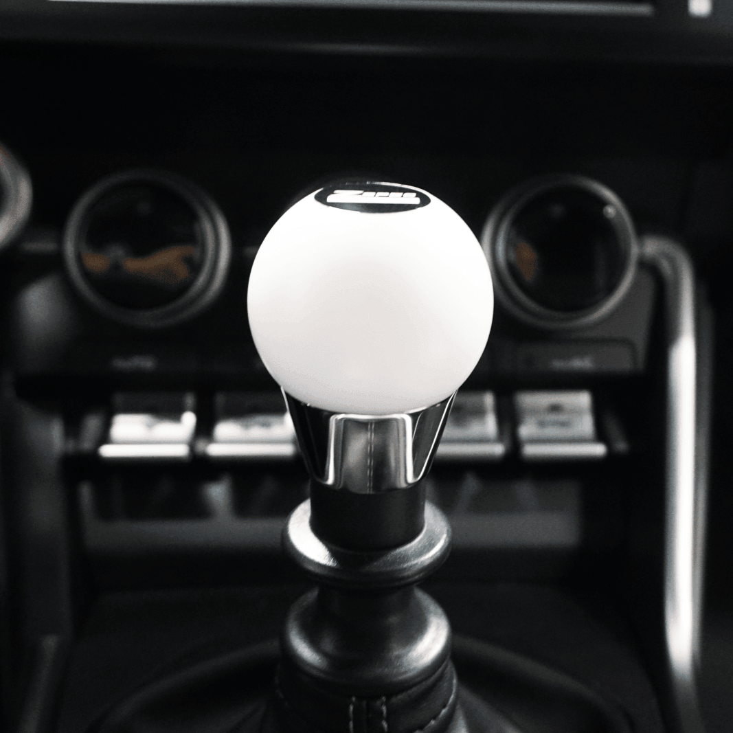 ZSPEC Shift Knob, M12-1.25, Delrin & Stainless, 4-Speed Shift Pattern Coin - ZSPEC Design LLC - Vehicle Parts & Accessories - 323, 626, accessory, EVO, EVO 10, mazdaspeed, mx3, Nismo, Nissan, patrol, probe, rx-7, rx7, Shift Knob - zspecdesign.com